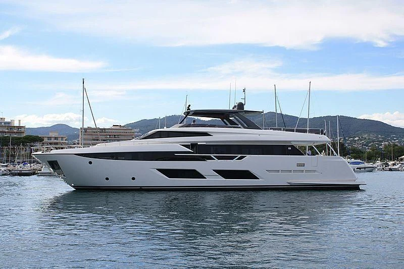 a white yacht in a harbor aboard NINETEEN Yacht for Sale