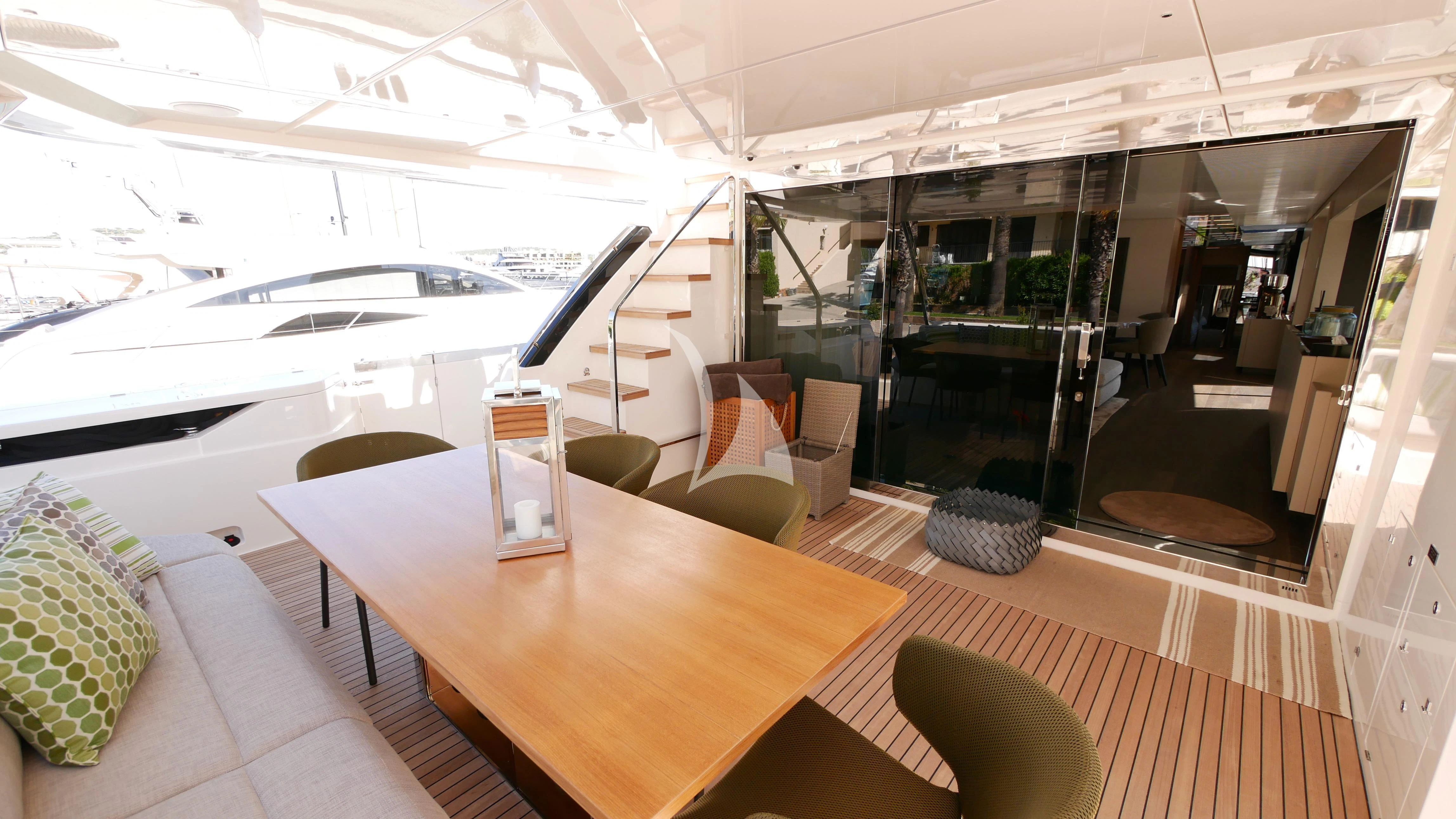 a room with a table and chairs aboard NINETEEN Yacht for Sale