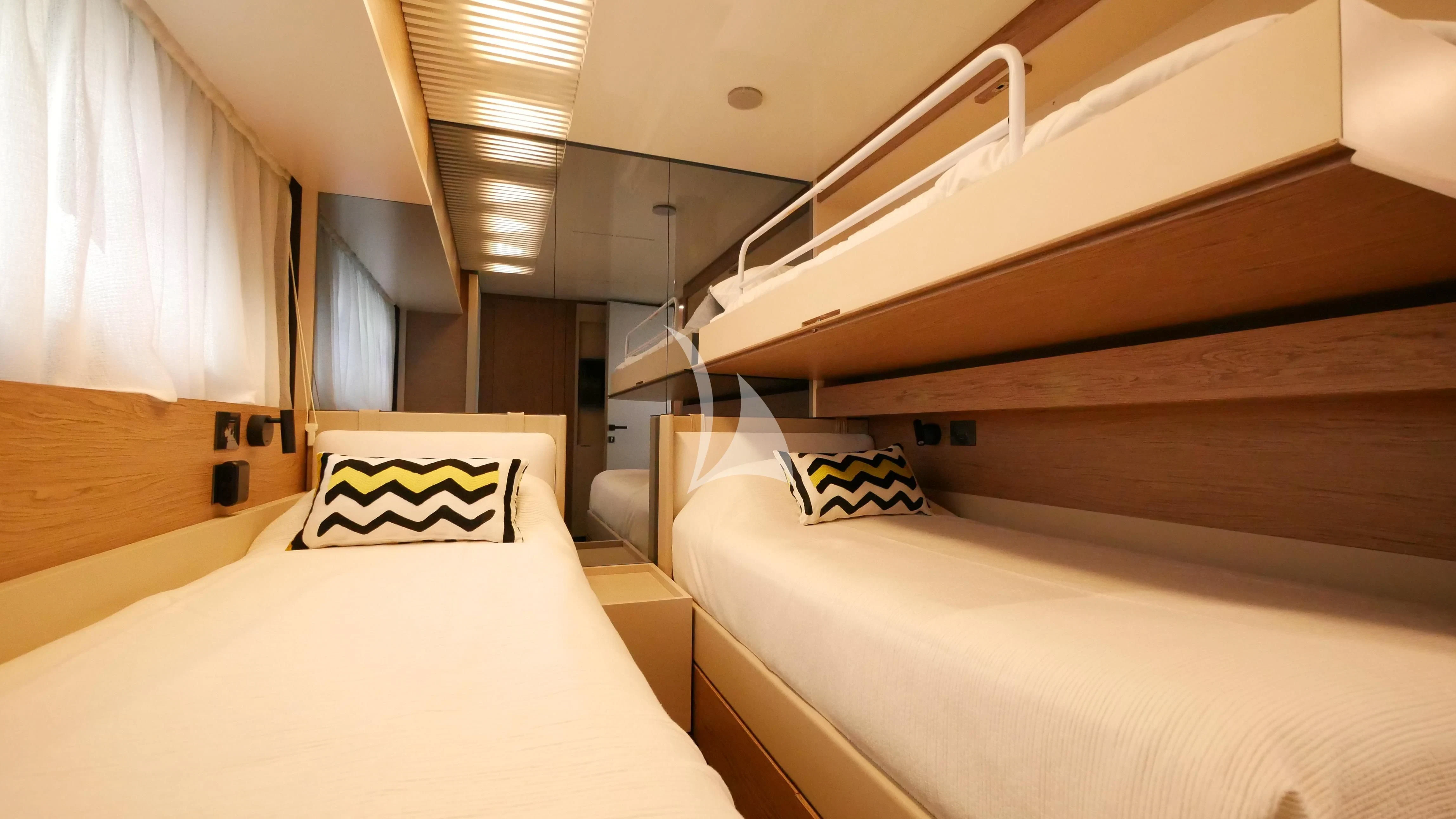 a room with bunk beds aboard NINETEEN Yacht for Sale