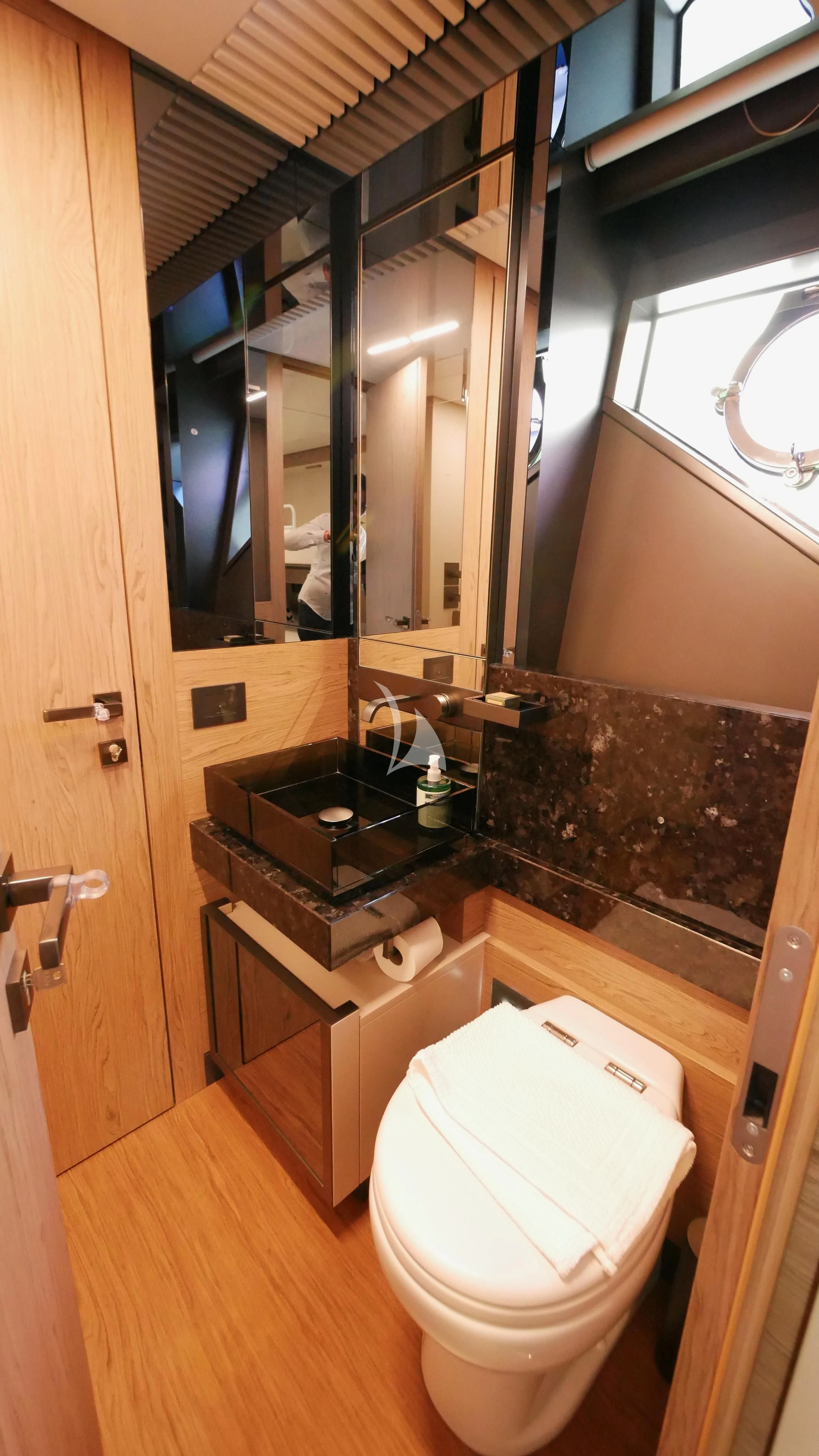 a bathroom with a sink and a toilet aboard NINETEEN Yacht for Sale