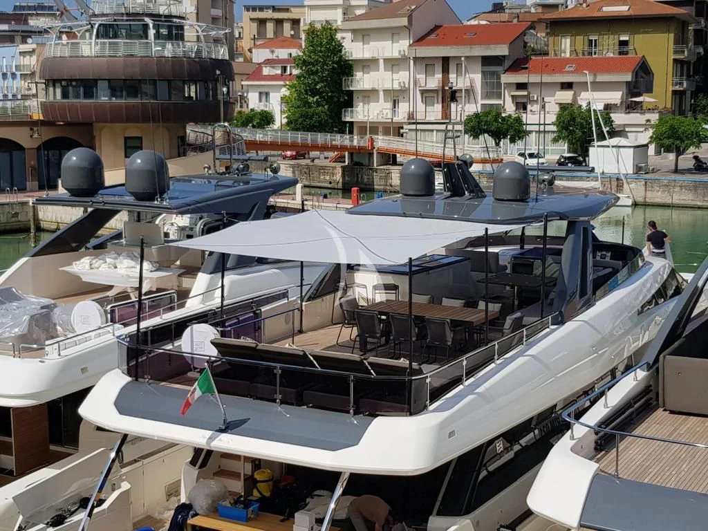 a large white boat with a black top and a black object on top aboard NINETEEN Yacht for Sale