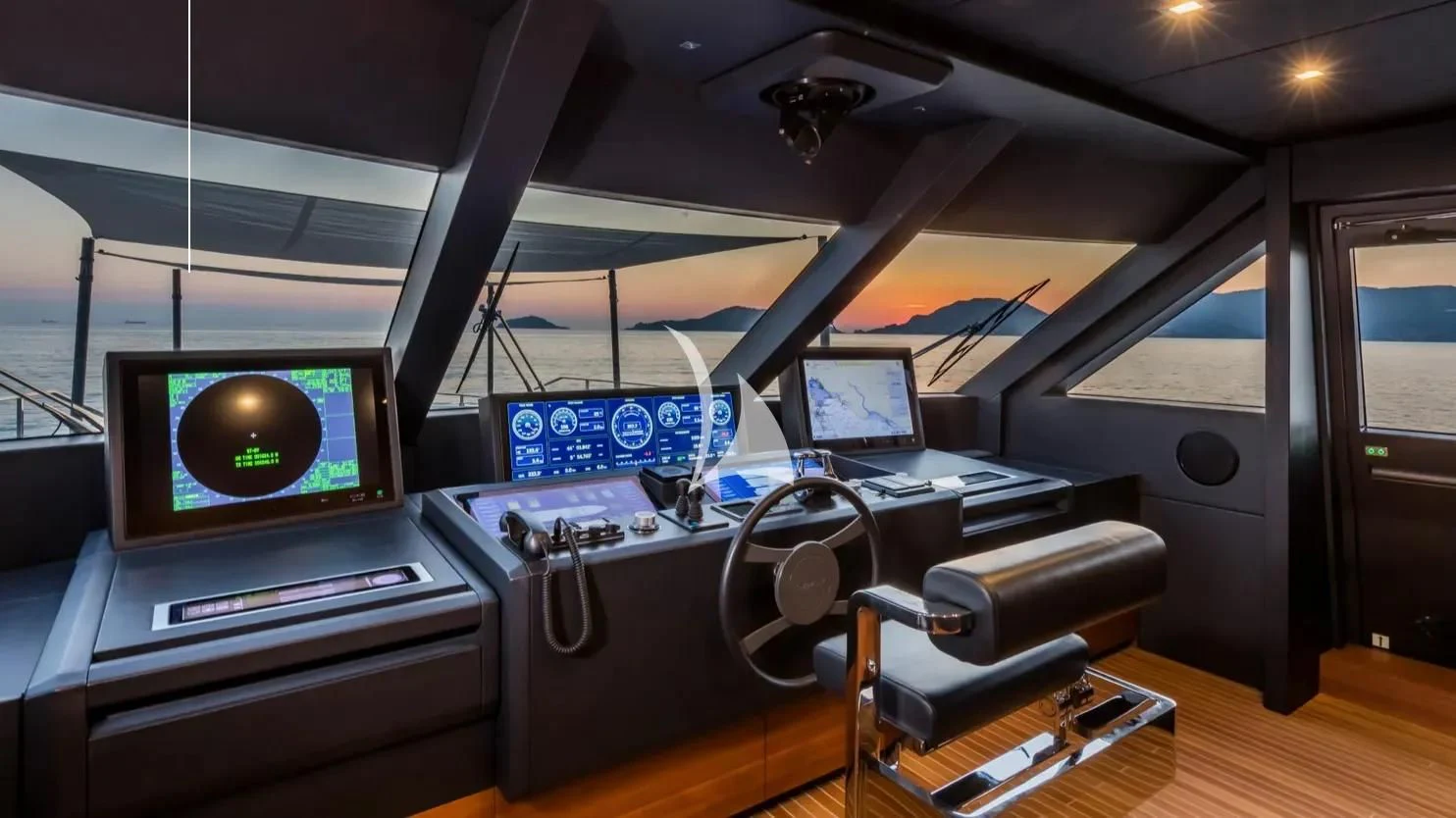 a room with a desk and computer aboard NINETEEN Yacht for Sale