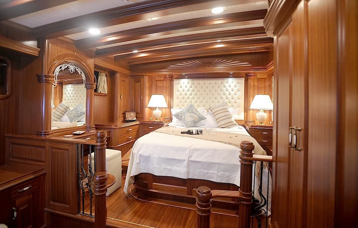 a bedroom with a large mirror aboard MARE NOSTRUM Yacht for Sale