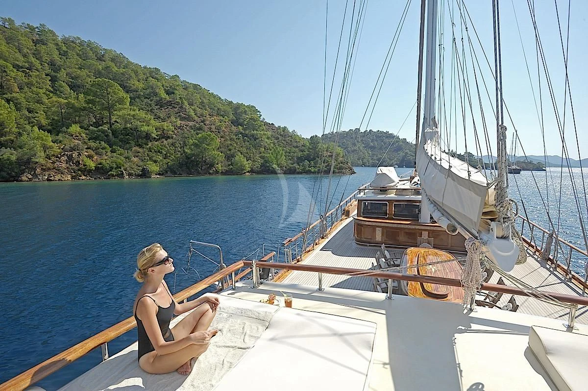 a person sitting on a boat aboard MARE NOSTRUM Yacht for Sale