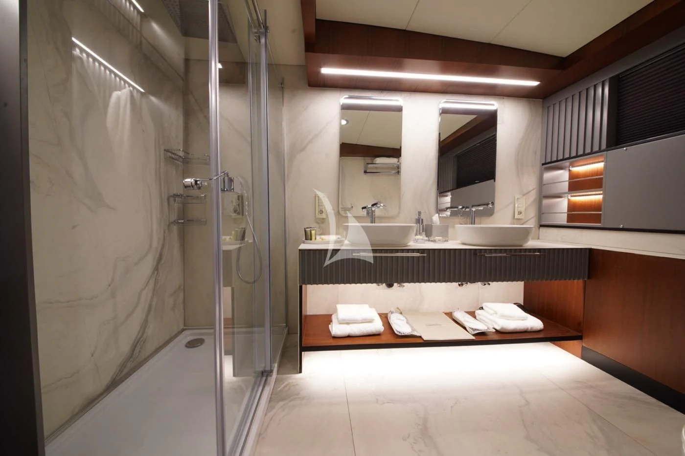 a bathroom with a shower and sinks aboard MARE NOSTRUM Yacht for Sale