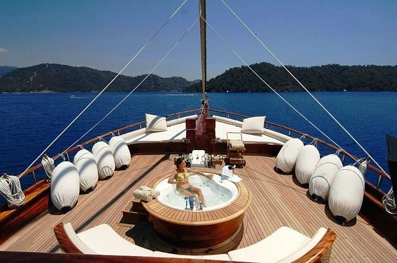 a boat with a couple of people on it aboard MARE NOSTRUM Yacht for Sale