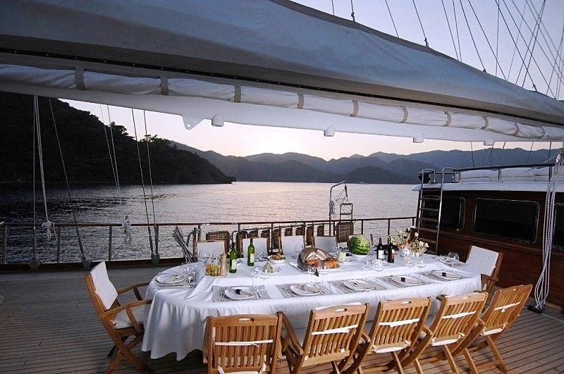 a table set up outside aboard MARE NOSTRUM Yacht for Sale