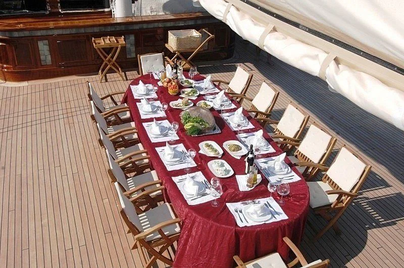 a table set with food aboard MARE NOSTRUM Yacht for Sale