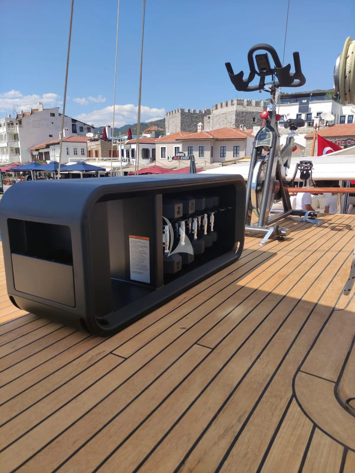 a large white box on a wooden deck aboard MARE NOSTRUM Yacht for Sale