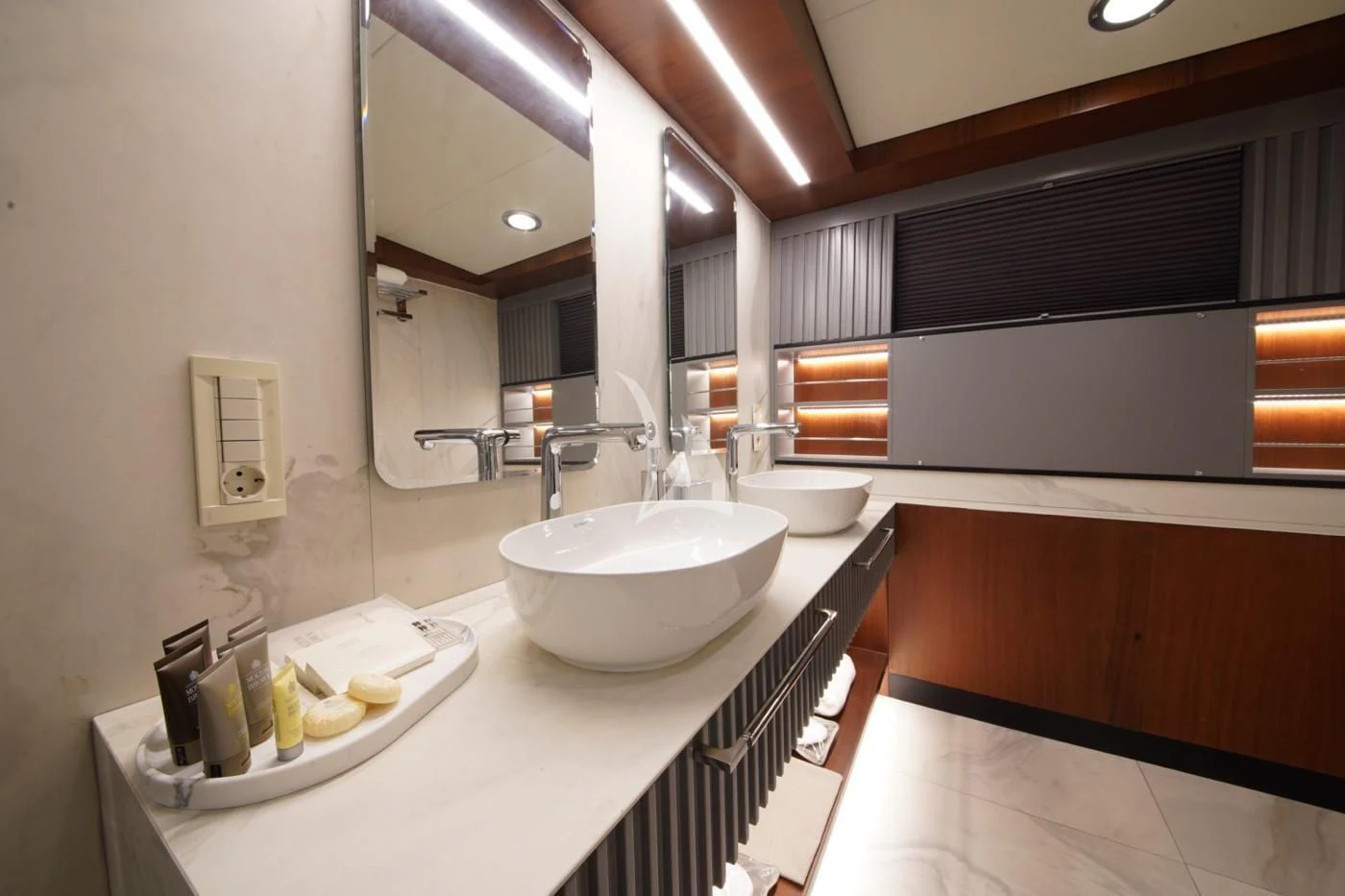 a bathroom with a sink and a mirror aboard MARE NOSTRUM Yacht for Sale
