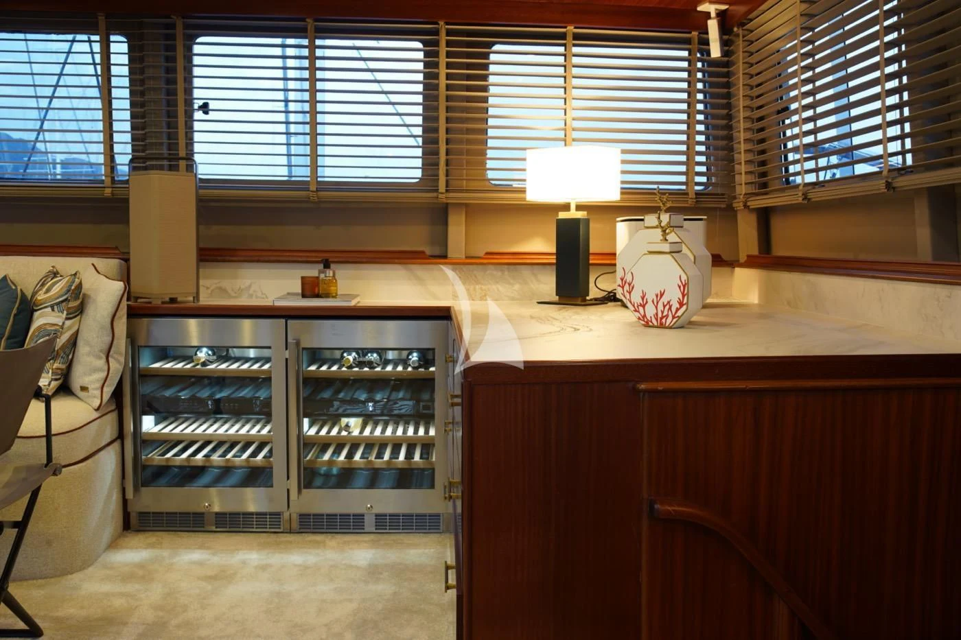 a room with a shelf and a shelf with glass bottles aboard MARE NOSTRUM Yacht for Sale