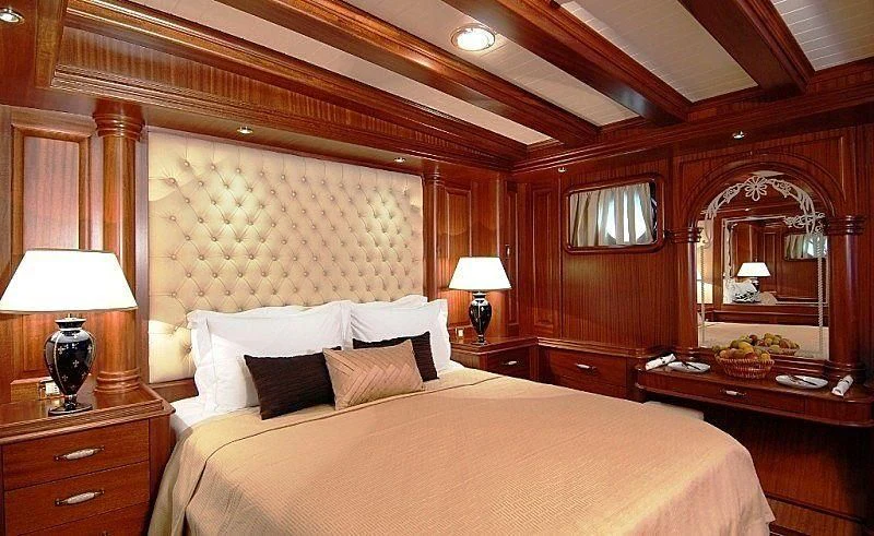 a bedroom with a large bed aboard MARE NOSTRUM Yacht for Sale