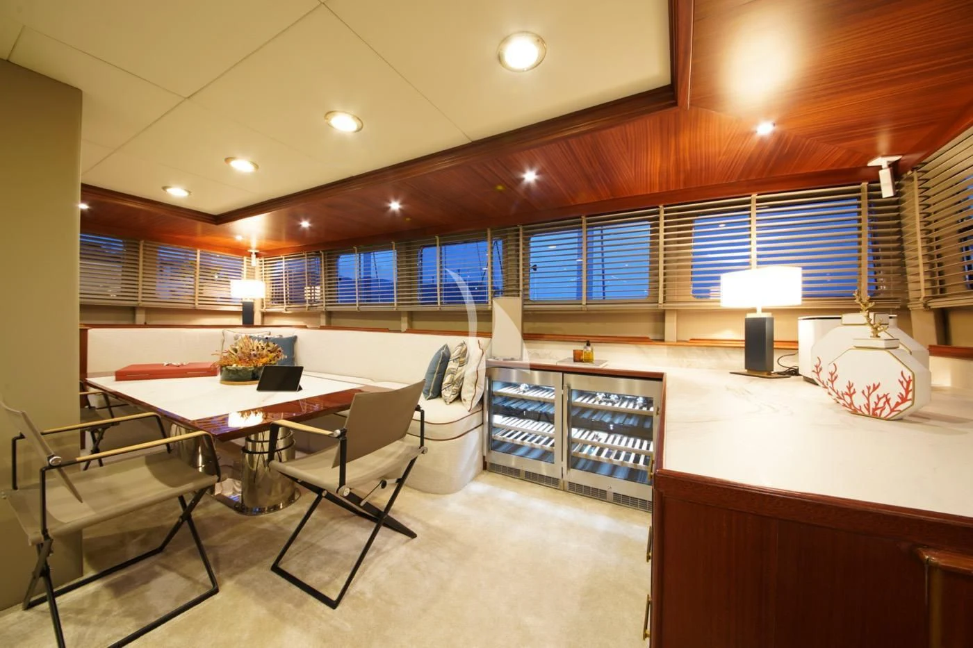 a room with a table and chairs aboard MARE NOSTRUM Yacht for Sale