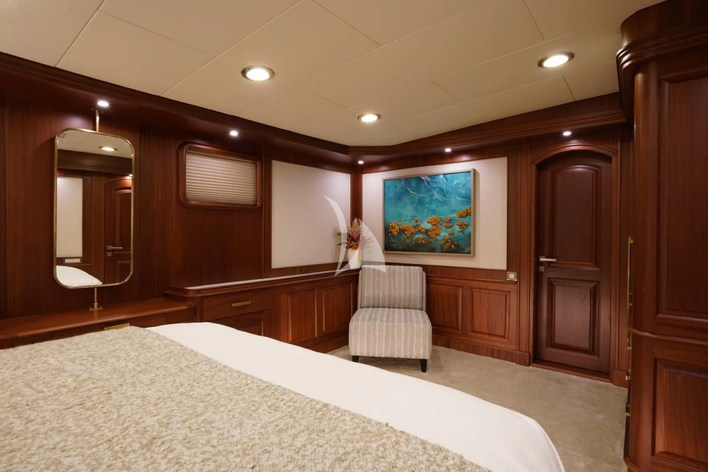 a large bedroom with a large mirror aboard MARE NOSTRUM Yacht for Sale
