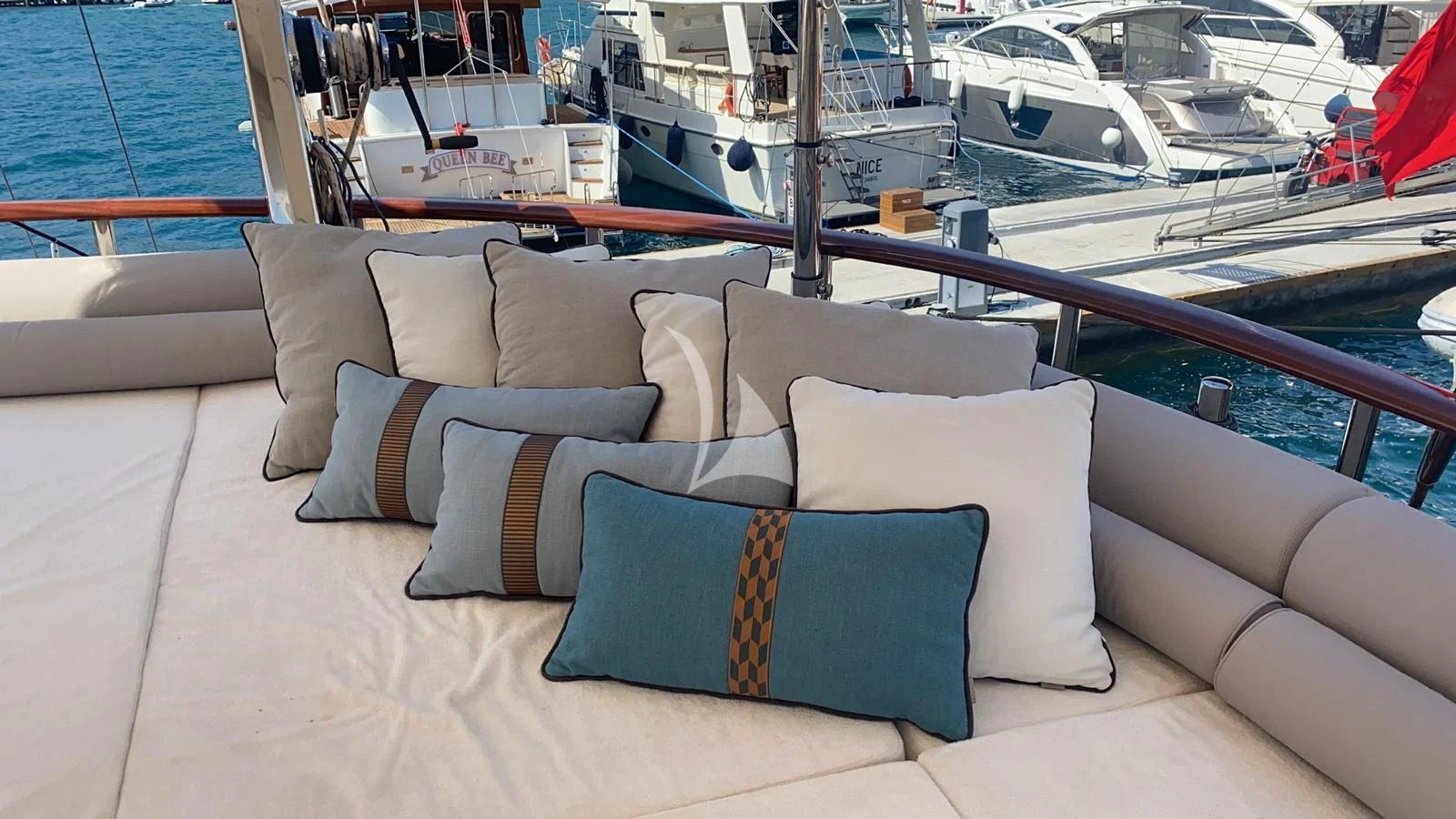 a couch with pillows on it aboard MARE NOSTRUM Yacht for Sale