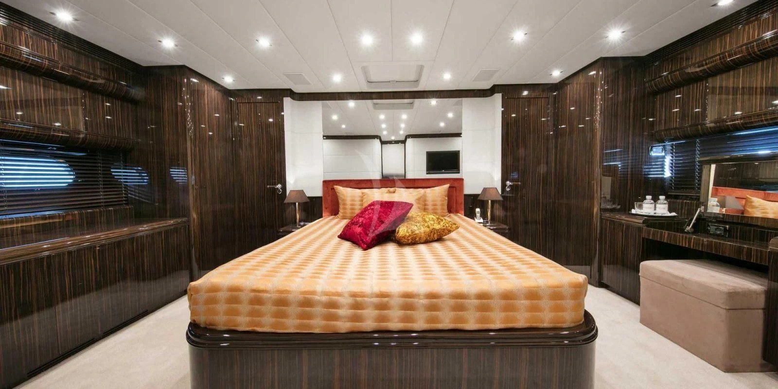 a large bed in a room aboard ATHOS Yacht for Sale