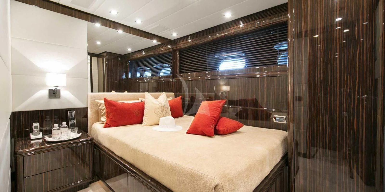 a bed with pillows on it aboard ATHOS Yacht for Sale