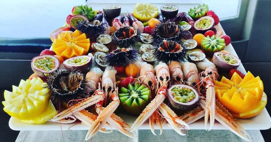 a table full of food aboard ATHOS Yacht for Sale