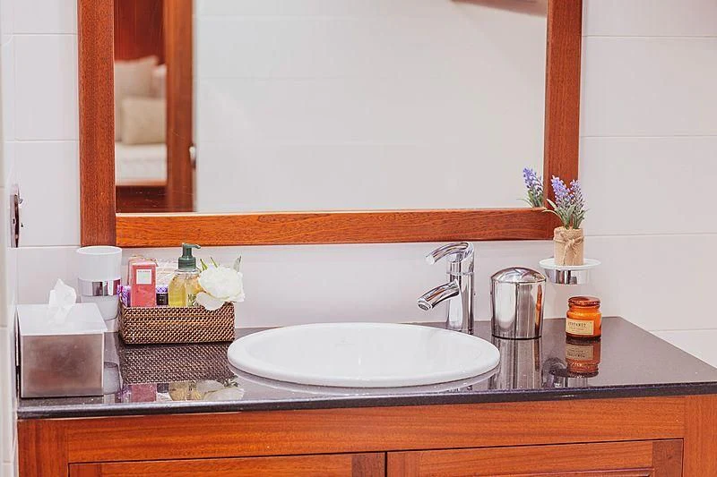a bathroom sink with a mirror above it aboard HIC SALTA Yacht for Sale