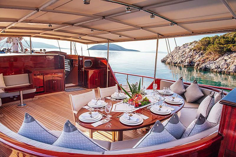 a table set for a meal aboard HIC SALTA Yacht for Sale