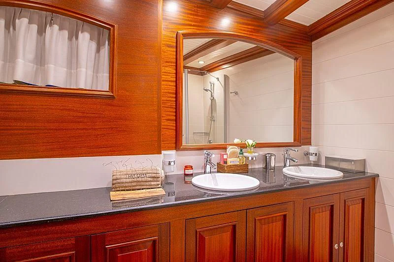 a bathroom with a large mirror aboard HIC SALTA Yacht for Sale