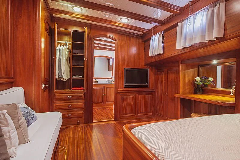a room with a bed and a television aboard HIC SALTA Yacht for Sale