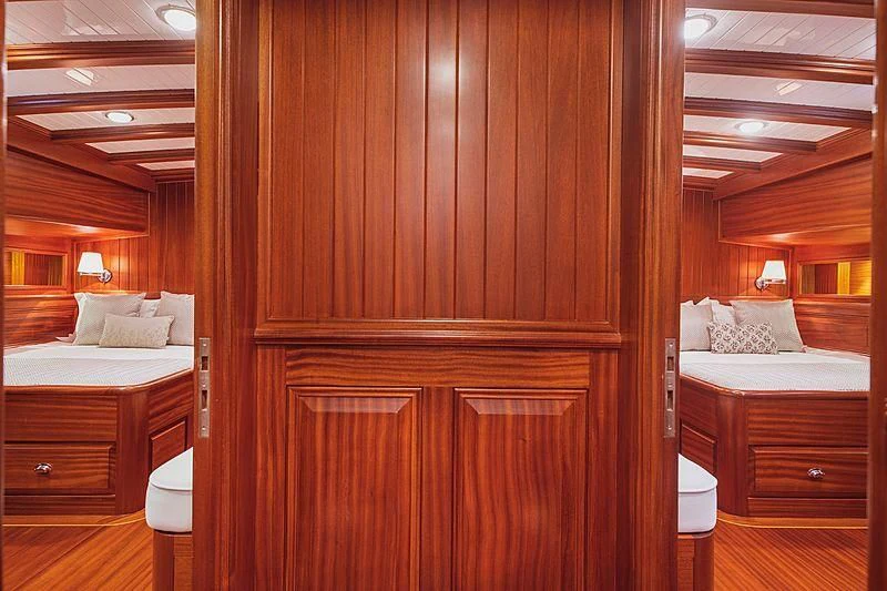 a room with a bed and a desk aboard HIC SALTA Yacht for Sale