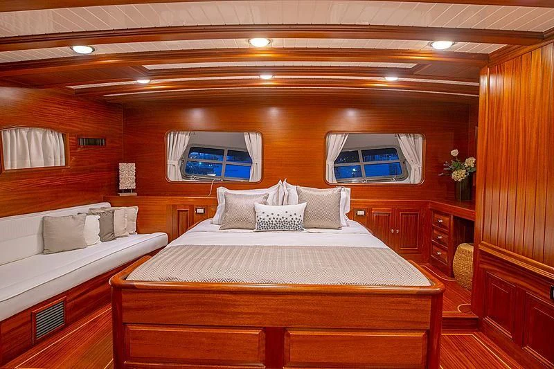 a room with a bed and a window aboard HIC SALTA Yacht for Sale