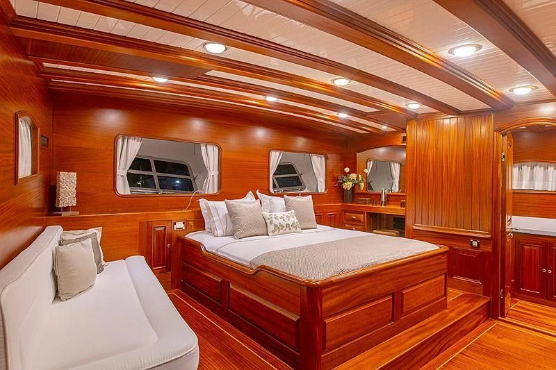 a room with a bed and a window aboard HIC SALTA Yacht for Sale