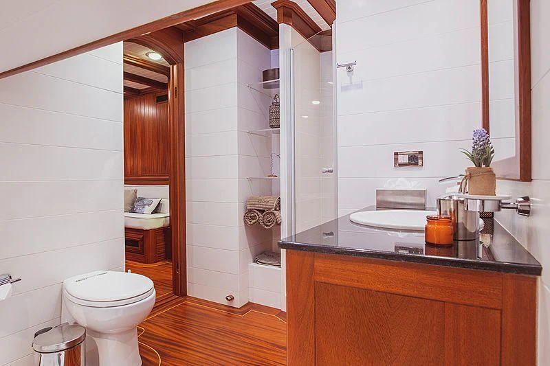a bathroom with a glass shower aboard HIC SALTA Yacht for Sale