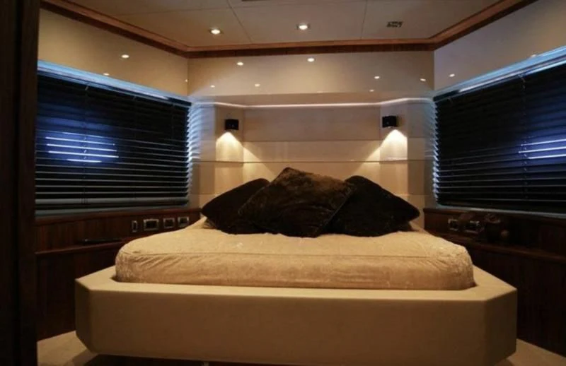 a bed in a room aboard CODE Yacht for Sale