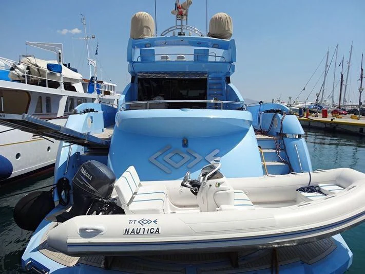 a group of boats sit in a harbor aboard CODE Yacht for Sale