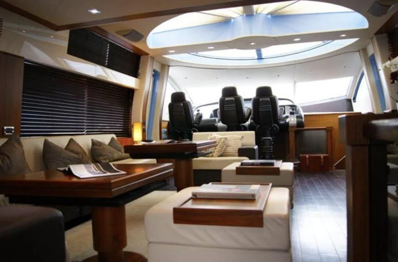 a room with a couch and a table aboard CODE Yacht for Sale