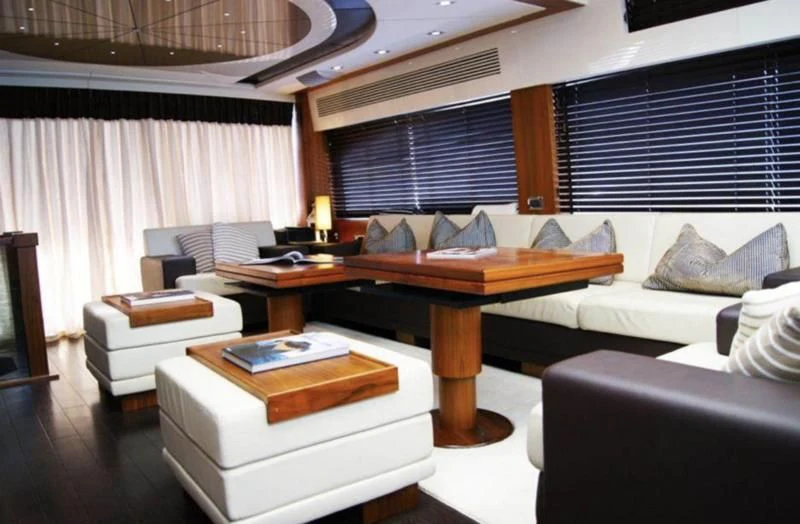 a room with a bed and a desk aboard CODE Yacht for Sale