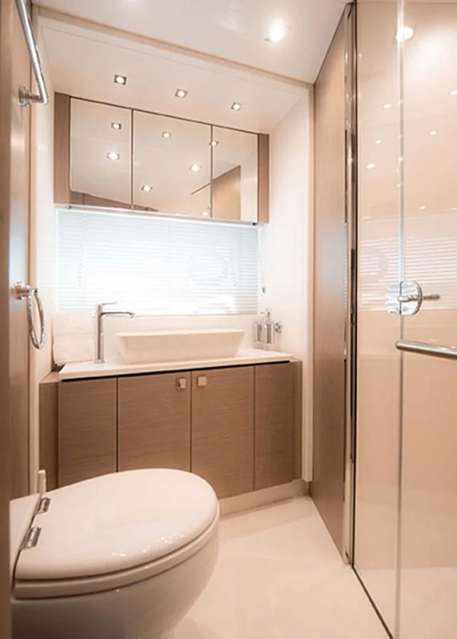 a bathroom with a toilet and sink aboard VALERIA Yacht for Sale