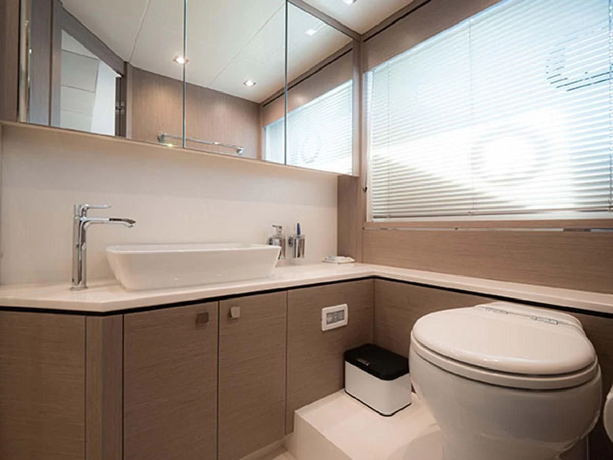 a bathroom with a toilet and a sink aboard VALERIA Yacht for Sale