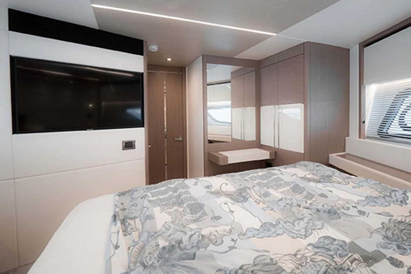 a bedroom with a bed and a television aboard VALERIA Yacht for Sale
