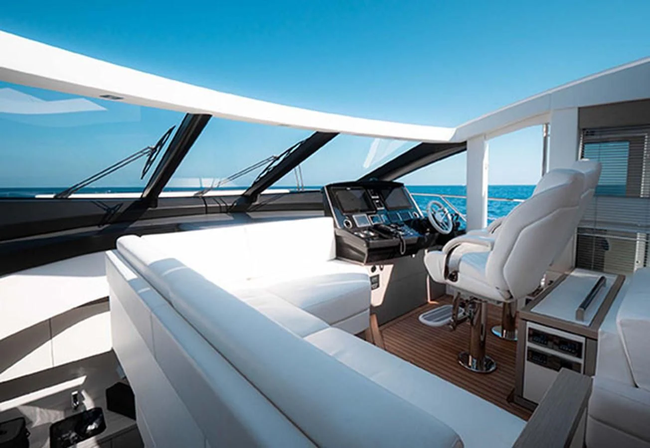 inside of a car with a desk and chairs and a window aboard VALERIA Yacht for Sale