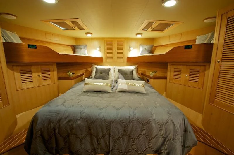 a bed in a cabin aboard MISS KULANI Yacht for Charter