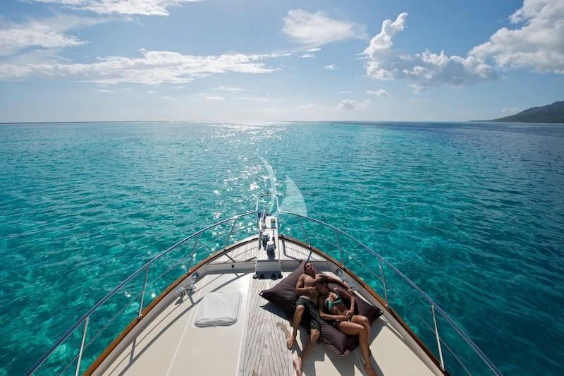 a boat with people on it in the water aboard MISS KULANI Yacht for Charter