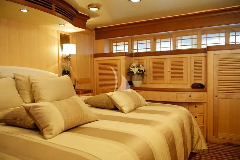 a large bed in a room aboard MISS KULANI Yacht for Charter