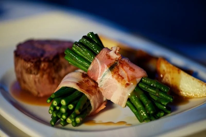 a plate of food aboard MISS KULANI Yacht for Charter