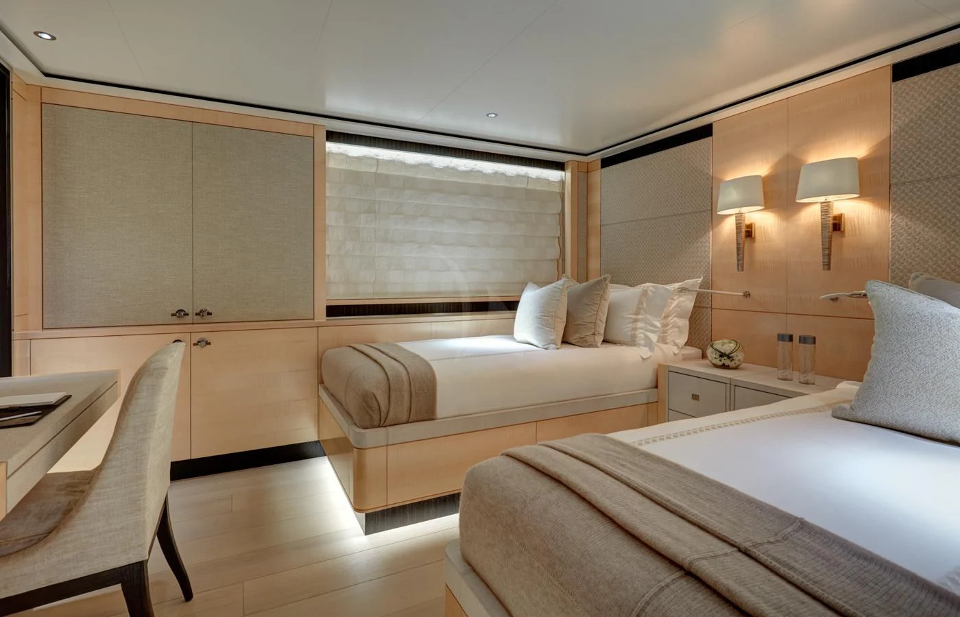 a room with a bed and a desk aboard LADY VICTORIA Yacht for Sale
