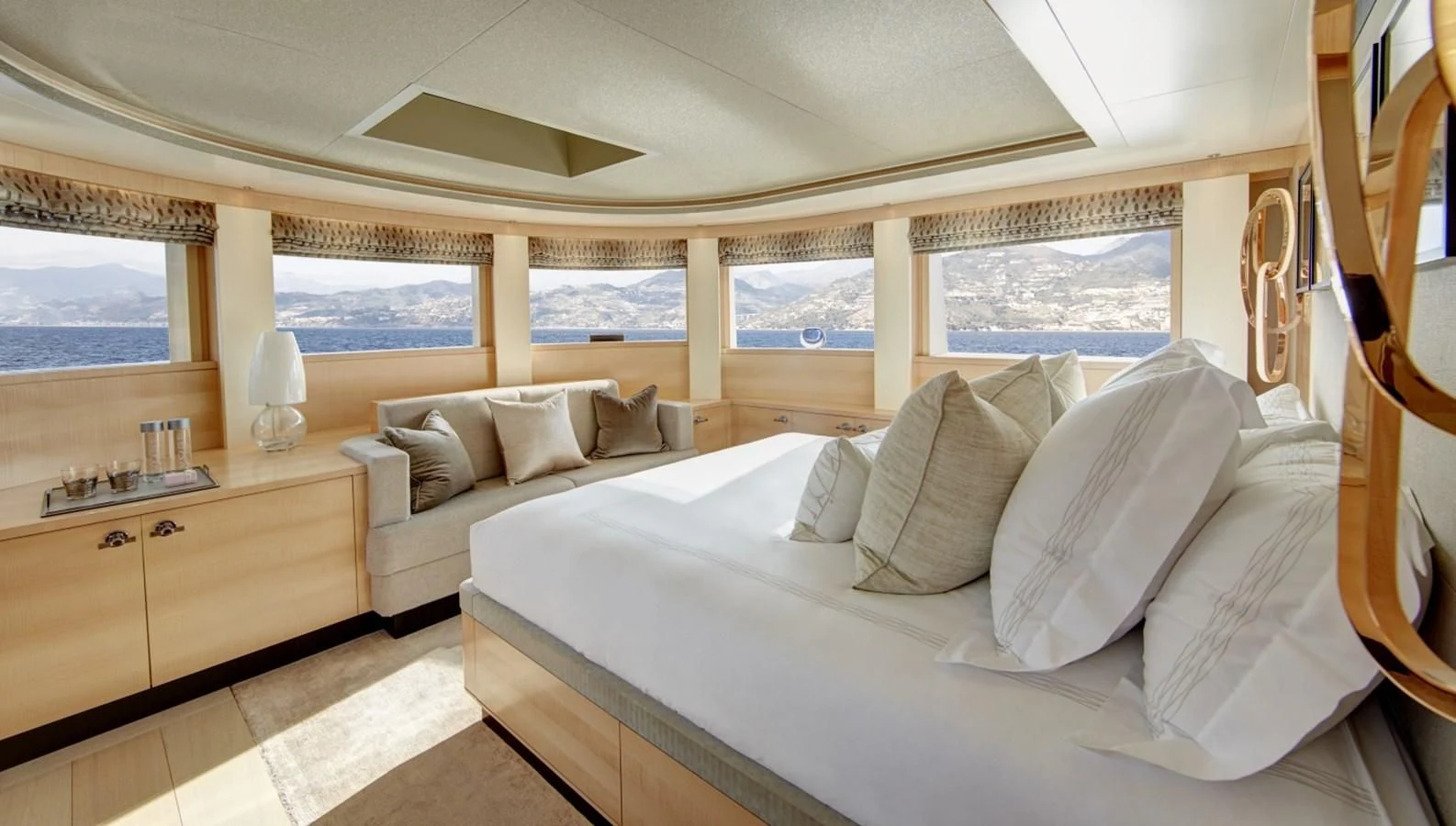 a room with a bed and a window aboard LADY VICTORIA Yacht for Sale