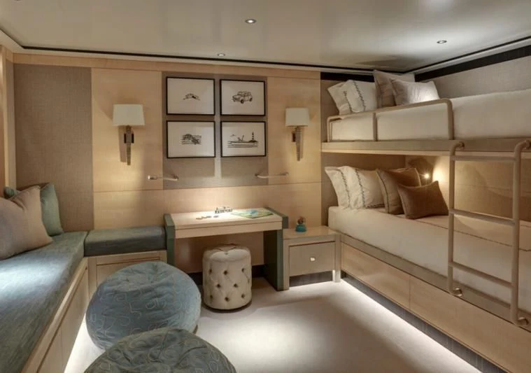 a bedroom with a bed and a couch aboard LADY VICTORIA Yacht for Sale
