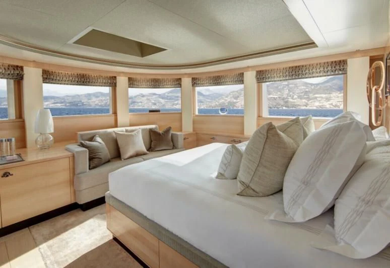 a large bed in a room aboard LADY VICTORIA Yacht for Sale
