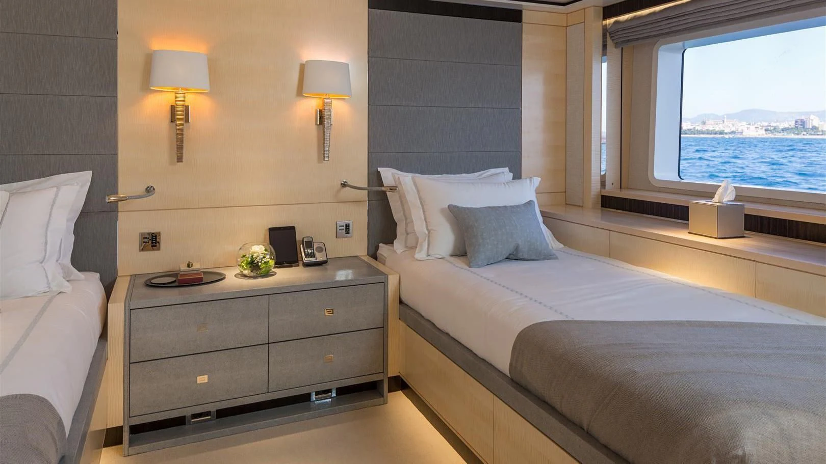 a room with a bed and a desk aboard LADY VICTORIA Yacht for Sale