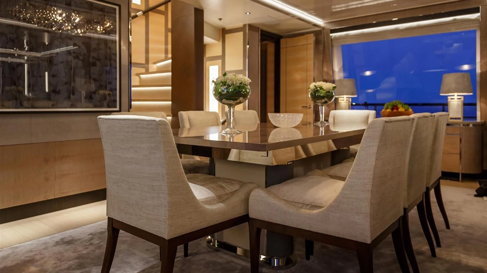 a room with a table chairs and a couch aboard LADY VICTORIA Yacht for Sale