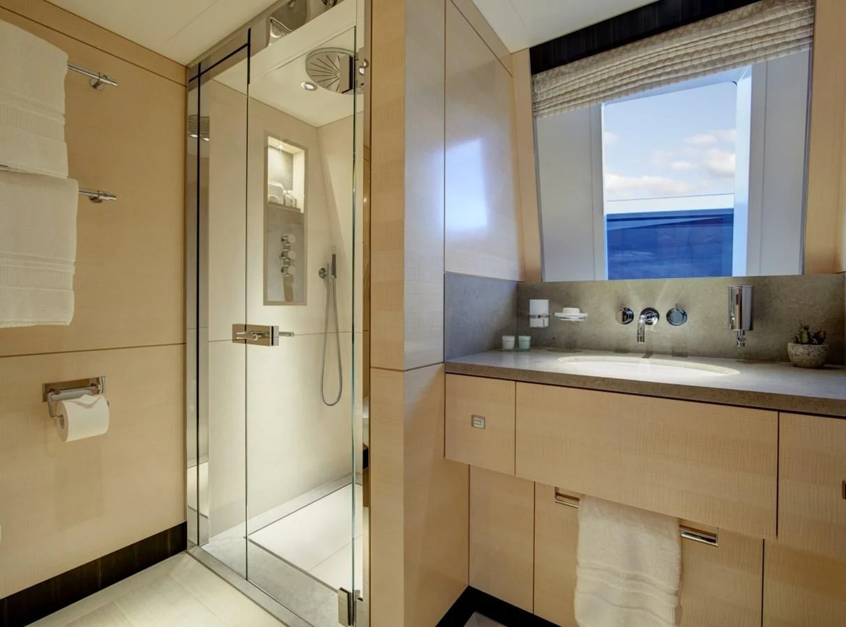 a bathroom with a large mirror aboard LADY VICTORIA Yacht for Sale