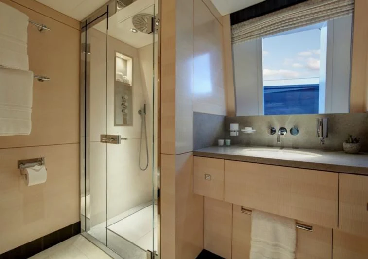 a bathroom with a glass shower aboard LADY VICTORIA Yacht for Sale